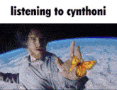 a man holding a butterfly in his hand with the words listening to cynthoni written below him