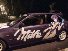 a purple car with milka written on the side of it