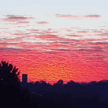 a sunset with a few clouds in it