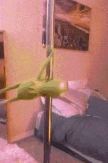 a green grasshopper on a pole in a bedroom