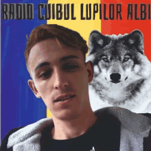 a poster with a man and a wolf with the words radio cuibul lupilor albi