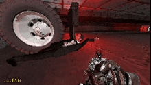 a screenshot of a video game showing a tire and a weapon