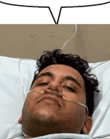 a man is laying in a hospital bed with an oxygen mask on his face