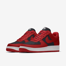 a pair of red and black nike air force sneakers