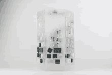 a clear container with a geometric pattern on it