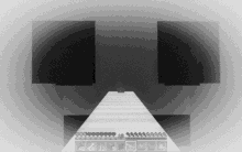 a black and white photo of a minecraft game with a staircase leading to a pyramid .