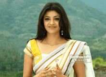 a woman in a white and yellow saree is featured on idlebrain.com