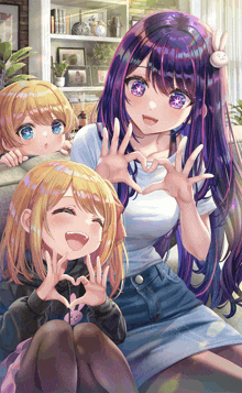 a girl with purple hair is sitting on a couch with two other girls