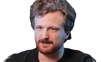 a man with curly hair and a beard is wearing a black shirt that says ' a ' on the sleeve