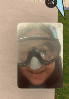 a picture of a girl wearing a goggles with the letters l and o on the bottom