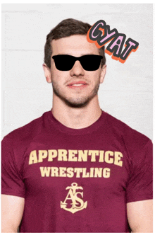 a man wearing sunglasses and an apprentice wrestling t-shirt