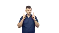 a man in a blue shirt is pointing up