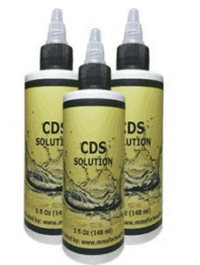 three bottles of cds solution are sitting next to each other on a white background