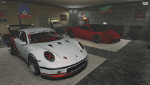 two sports cars are parked in a garage with a beer sign behind them