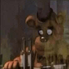 a cartoon bear is sitting at a table with bottles of alcohol .