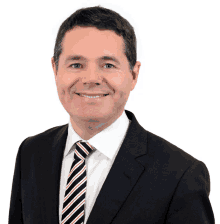 a man in a suit and striped tie smiles for the camera