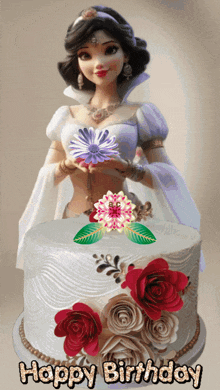 a doll is holding a flower in front of a happy birthday cake