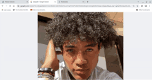 a picture of a young boy with curly hair is displayed on a google search page