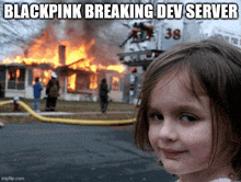 a little girl stands in front of a burning house with the words blackpink breaking dev server