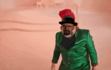 a man with a beard and glasses is wearing a green suit and hat .