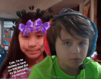 a boy and a girl with a purple bow on their faces