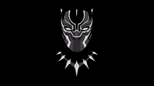 a black panther mask and necklace on a black background