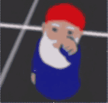 a blurry picture of a gnome wearing a red hat and a blue shirt