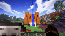 a screenshot of a minecraft game shows a brick building with a blue stripe on the side