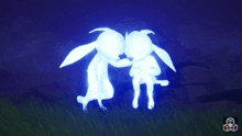 two glowing rabbits are standing next to each other in the dark