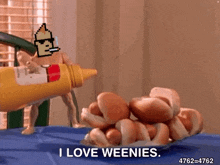 a man is pouring mustard on a bunch of hot dogs and says `` i love weenies '' .