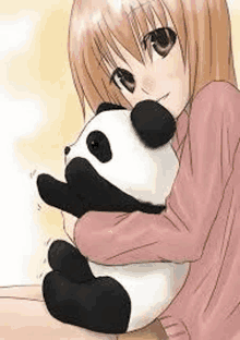 a girl in a pink shirt is holding a panda bear .