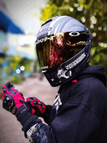 a person wearing a helmet with a sticker that says killgear