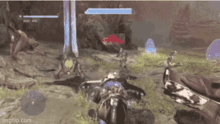 a video game is being played on a computer and a person is riding a motorcycle in a field .