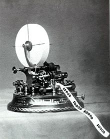 a black and white photo of a machine with a ribbon that says 10000