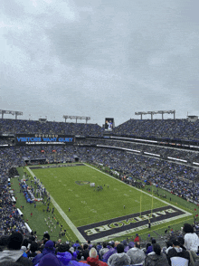 a football stadium with a banner that says visiting fans quiet