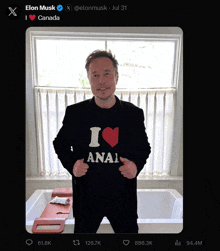 elon musk is wearing a black shirt that says i love anal