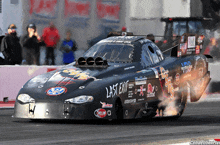 a black race car with last exit written on it