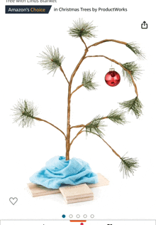 a small christmas tree with a blue scarf on it