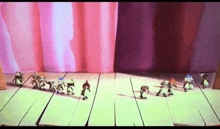 a bunch of cartoon characters are standing on a wooden floor