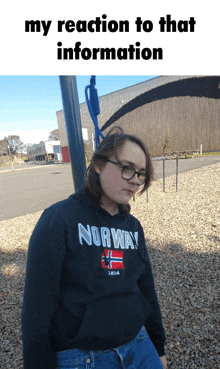 a girl wearing a hoodie that says norway is standing in a playground