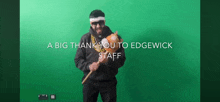 a man holding a hammer with the words a big thank you to edgewick staff