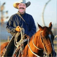 a man wearing a cowboy hat and holding a lasso is riding a horse