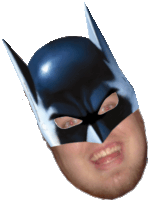 a man is wearing a batman mask with a smile on his face