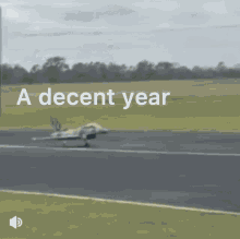 a picture of a plane on a runway with the words " a decent year " written above it