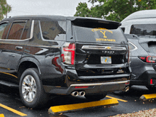 a black suv with a yellowstone ranch sticker on the back window