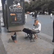 a man wearing a horse mask is playing a piano in front of a sign that says casino v.i.p. club .