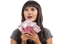 a woman is holding a bunch of money in her hands with a surprised expression on her face