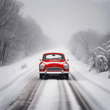 a red car is driving down a snowy road with a license plate that reads just raid