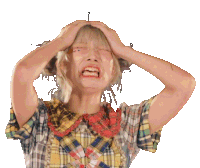 a woman in a plaid shirt is holding her head with her hands