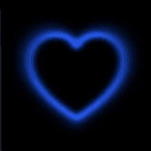 a blue neon heart is glowing on a black background